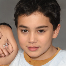 Joyful white child male with short  brown hair and brown eyes