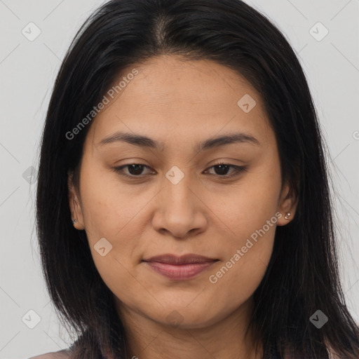 Joyful latino young-adult female with long  brown hair and brown eyes