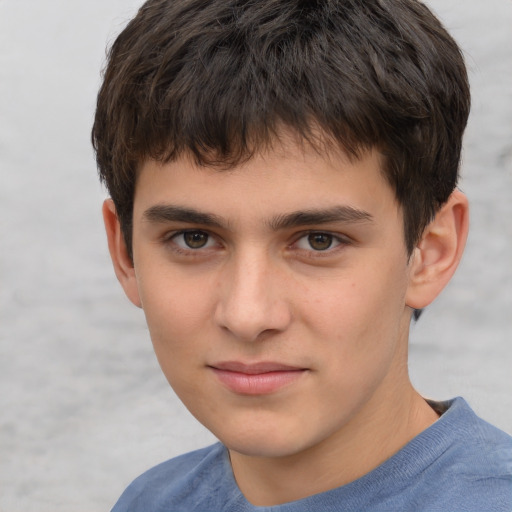Joyful white child male with short  brown hair and brown eyes