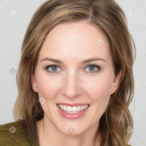 Joyful white young-adult female with medium  brown hair and green eyes