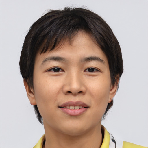 Joyful asian young-adult male with short  brown hair and brown eyes