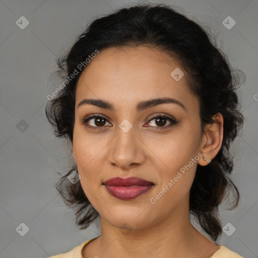 Joyful latino young-adult female with medium  brown hair and brown eyes