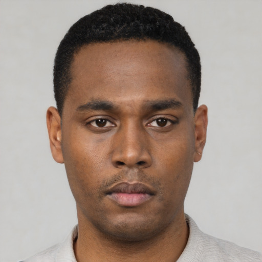 Neutral black young-adult male with short  black hair and brown eyes