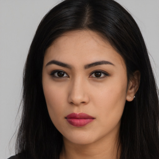 Neutral latino young-adult female with long  black hair and brown eyes