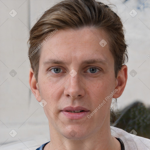 Joyful white adult male with short  brown hair and grey eyes