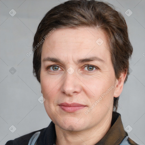 Joyful white adult male with short  brown hair and grey eyes