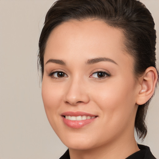 Joyful white young-adult female with medium  brown hair and brown eyes