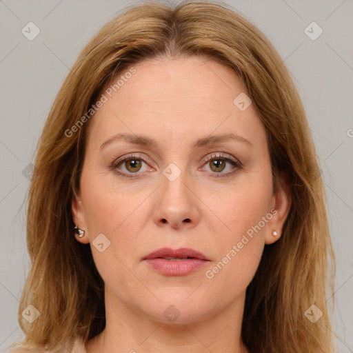 Joyful white adult female with medium  brown hair and green eyes