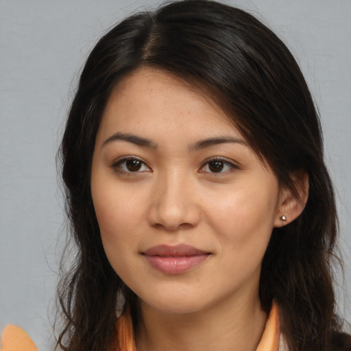 Joyful asian young-adult female with long  brown hair and brown eyes
