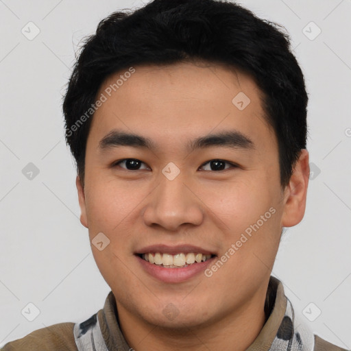 Joyful asian young-adult male with short  black hair and brown eyes