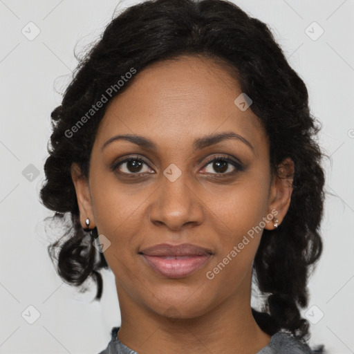 Joyful black adult female with medium  brown hair and brown eyes