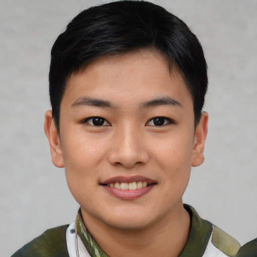 Joyful asian young-adult female with short  black hair and brown eyes