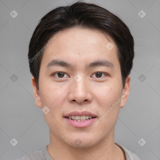 Joyful asian young-adult male with short  brown hair and brown eyes