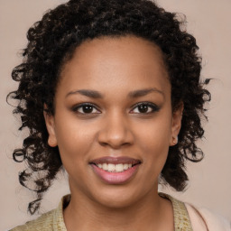 Joyful black young-adult female with medium  brown hair and brown eyes