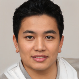 Joyful asian young-adult male with short  black hair and brown eyes