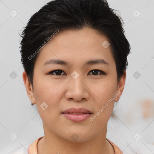 Joyful asian young-adult female with short  brown hair and brown eyes