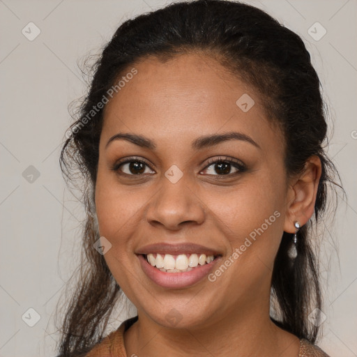 Joyful latino young-adult female with medium  brown hair and brown eyes