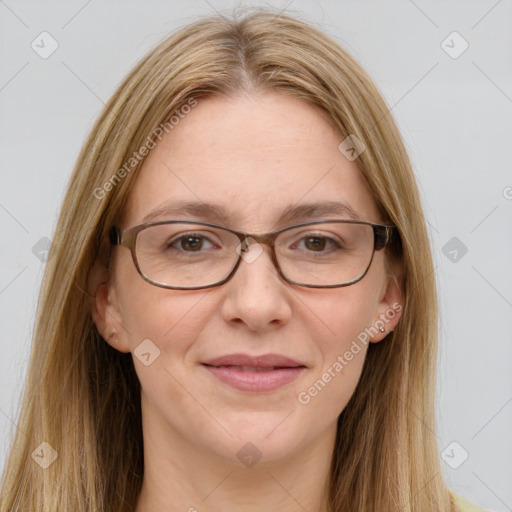 Joyful white adult female with long  brown hair and green eyes