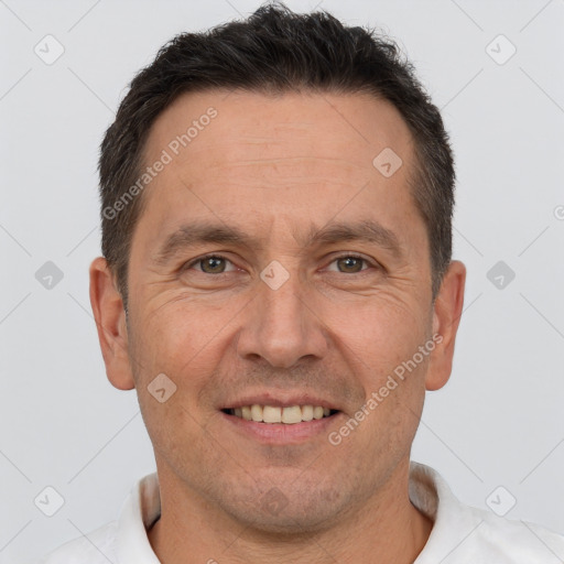 Joyful white adult male with short  brown hair and brown eyes