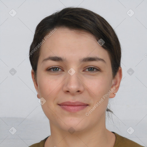 Joyful white young-adult female with short  brown hair and grey eyes