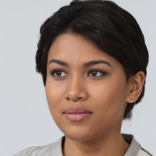 Joyful latino young-adult female with medium  black hair and brown eyes