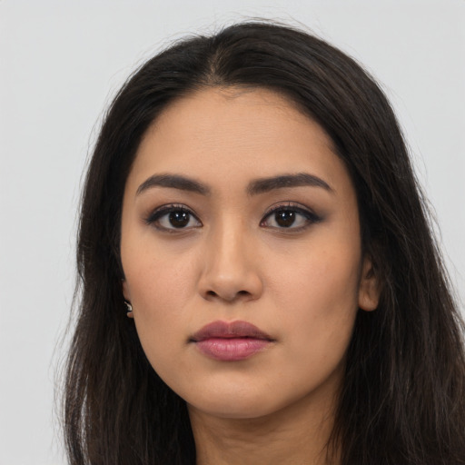 Neutral latino young-adult female with long  black hair and brown eyes