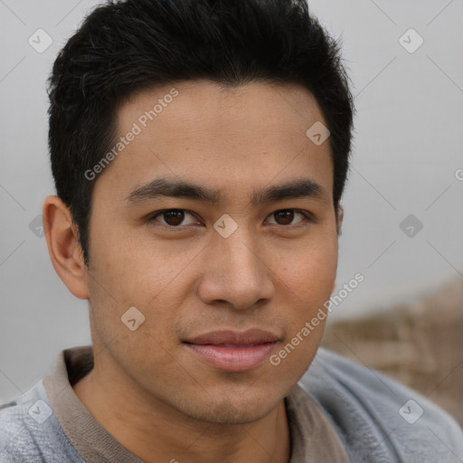 Joyful asian young-adult male with short  brown hair and brown eyes