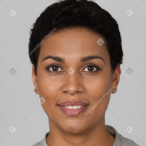 Joyful black young-adult female with short  black hair and brown eyes