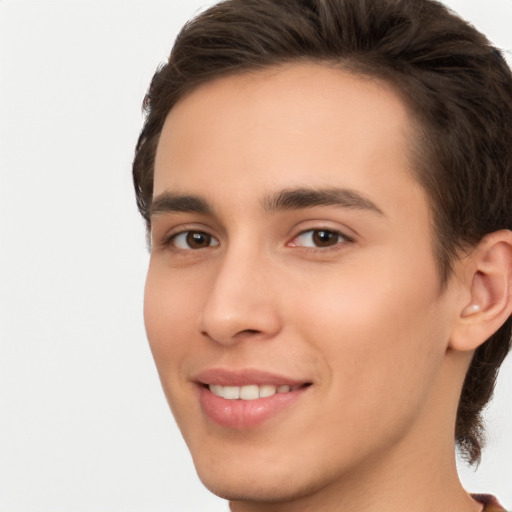 Joyful white young-adult male with medium  brown hair and brown eyes