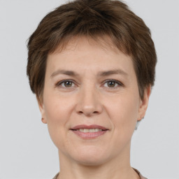 Joyful white adult female with short  brown hair and brown eyes