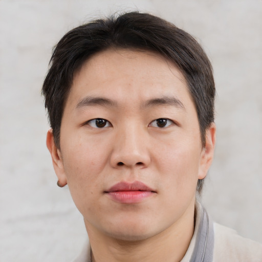 Neutral asian adult male with short  brown hair and brown eyes