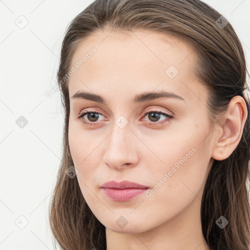 Neutral white young-adult female with long  brown hair and grey eyes