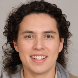 Joyful white young-adult male with medium  brown hair and brown eyes