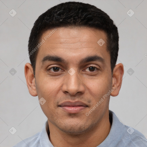 Joyful white young-adult male with short  black hair and brown eyes