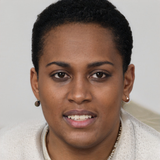 Joyful black young-adult female with short  brown hair and brown eyes
