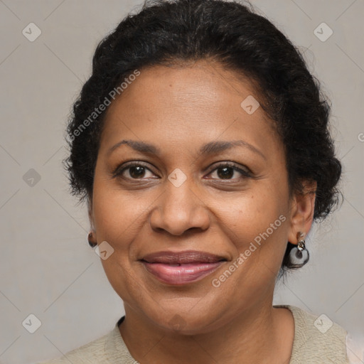 Joyful black adult female with short  brown hair and brown eyes