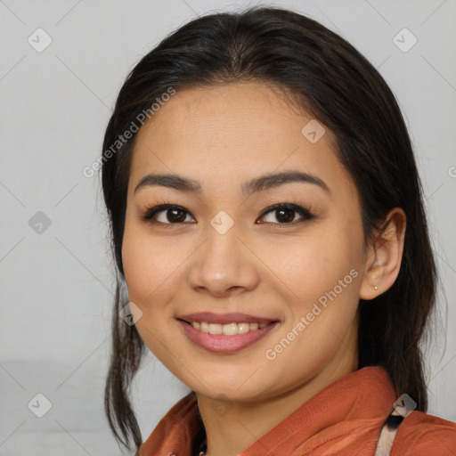 Joyful asian young-adult female with medium  brown hair and brown eyes