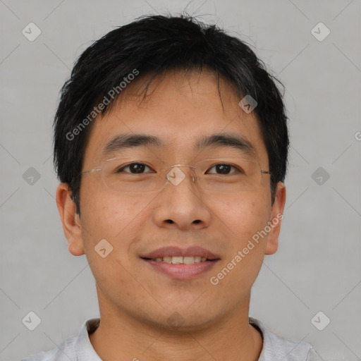 Joyful asian young-adult male with short  brown hair and brown eyes