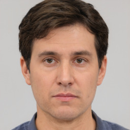 Neutral white adult male with short  brown hair and brown eyes