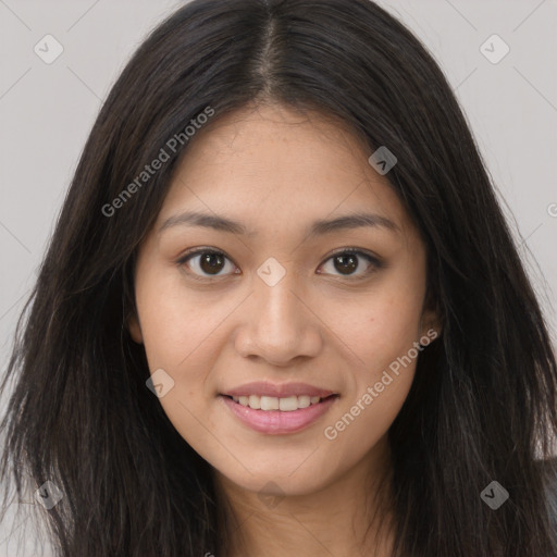 Joyful asian young-adult female with long  brown hair and brown eyes