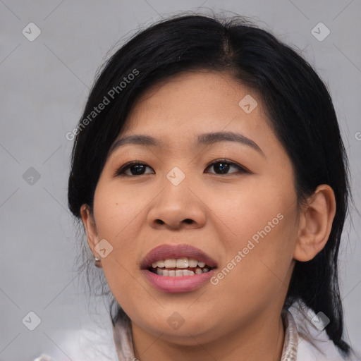 Joyful asian young-adult female with medium  black hair and brown eyes