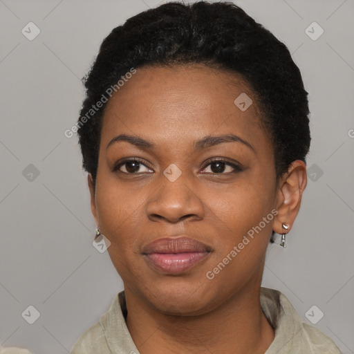 Joyful black young-adult female with short  black hair and brown eyes