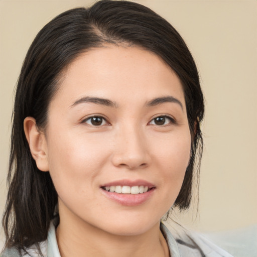 Joyful white young-adult female with medium  brown hair and brown eyes