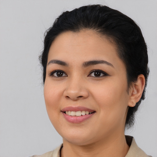 Joyful asian young-adult female with medium  black hair and brown eyes