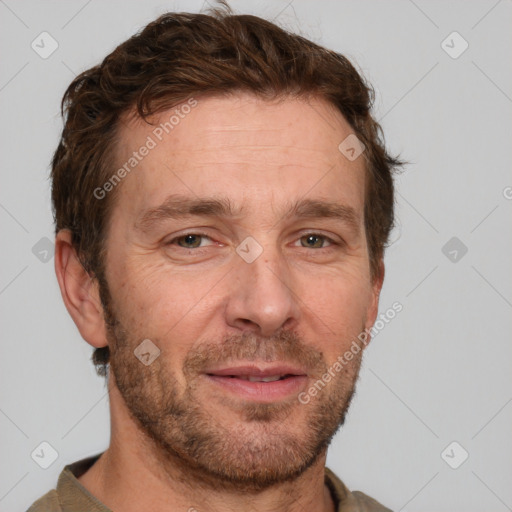 Joyful white adult male with short  brown hair and grey eyes