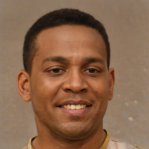Joyful latino young-adult male with short  brown hair and brown eyes