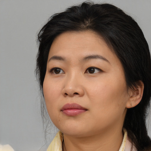 Neutral asian young-adult female with medium  brown hair and brown eyes
