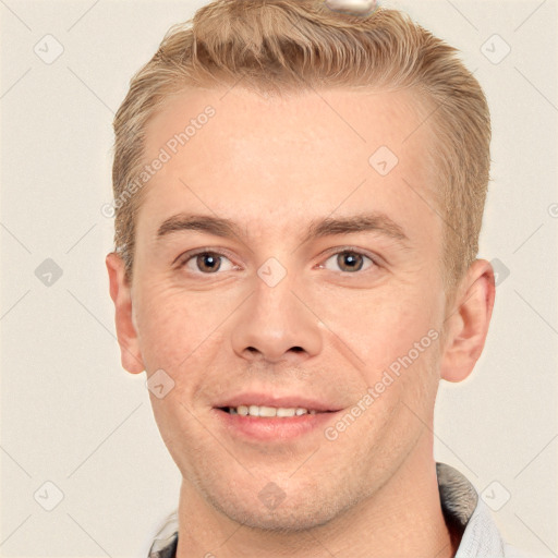 Joyful white adult male with short  brown hair and grey eyes