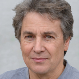 Joyful white middle-aged male with short  brown hair and brown eyes