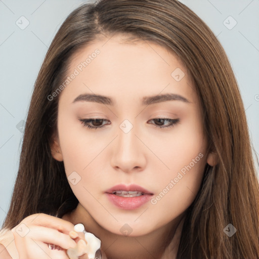 Neutral white young-adult female with long  brown hair and brown eyes